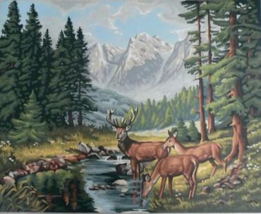 Mountains in the distance in a forest scene with three deer drinking from a stream with fir trees