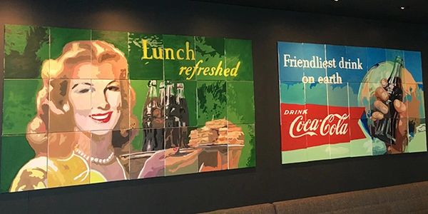 Two custom murals made by the participants at Coca-Cola