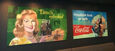 Two, custom collaborative murals made by team members at Coca-Cola