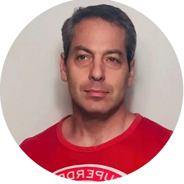 Handsome painting instructor in a red t-shirt with brown hair