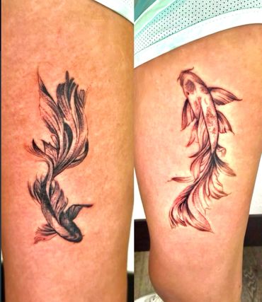 Two koi fish tattoos with detailed fins on thighs.