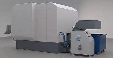 the Olimin8r, a smaller automatic pressure filter attached to a CNC machine on a manufacturing floor