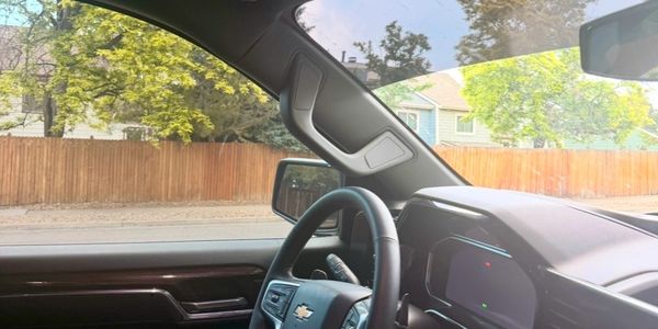 Interior view of a Chevrolet vehicle focusing on the steering wheel and dashboard.