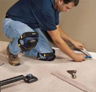 Close up shot of a man fixing mat of a room