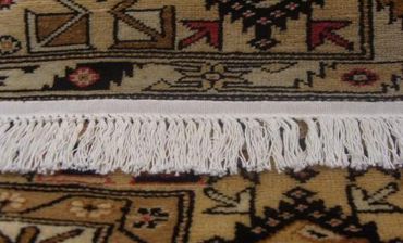 Close up image of a door mat with designs