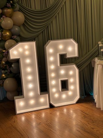 Illuminated number 16 decoration for a celebration.