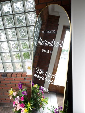 Elegant mirror sign welcomes guests to Alexandra's sweet 16 party.