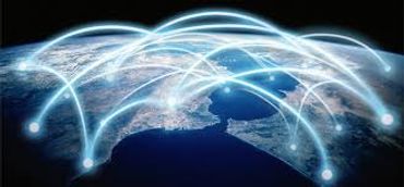 Glowing digital network connections over a geographic map at night.