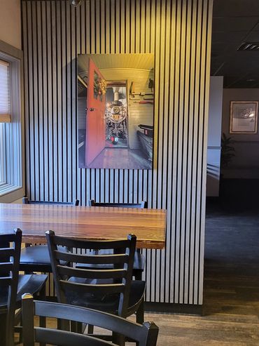 Acoustical slat restaurant installation with acoustic art print
