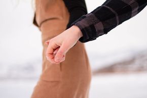 Swansea Wales Wedding photographer photographs Salt Lake City couple’s hands as part of their engage