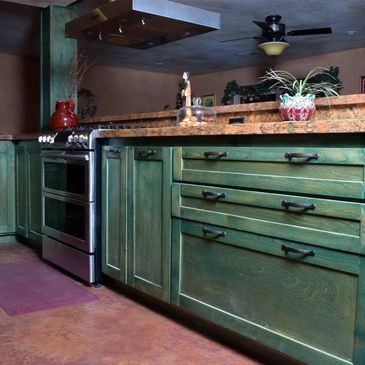 Luxury kitchen remodel:  Gray cabinets, quartz countertops, and farmhouse sink.