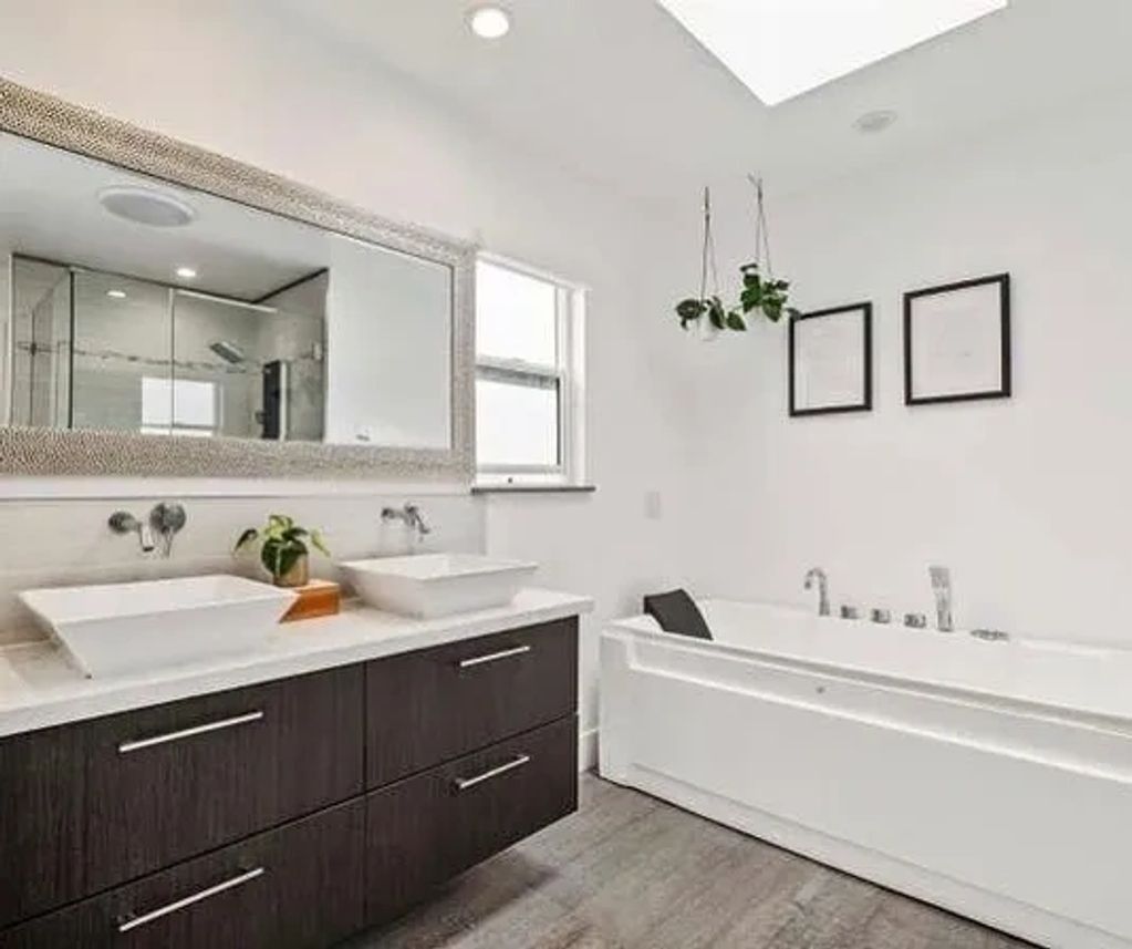 Luxury kitchen remodel featuring modern cabinetry, quartz countertops, and a farmhouse sink.