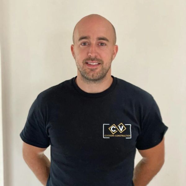 Director Luke in black logo tshirt