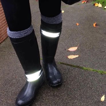 Lace and filigree bands around rainboots. Flash on and the light is been reflected back.