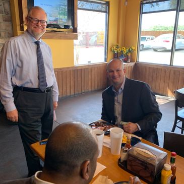 Greg Fail with McNeff Commercial Real Estate Greeting Guests.