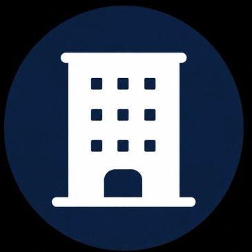 White building icon on a dark blue circular background.