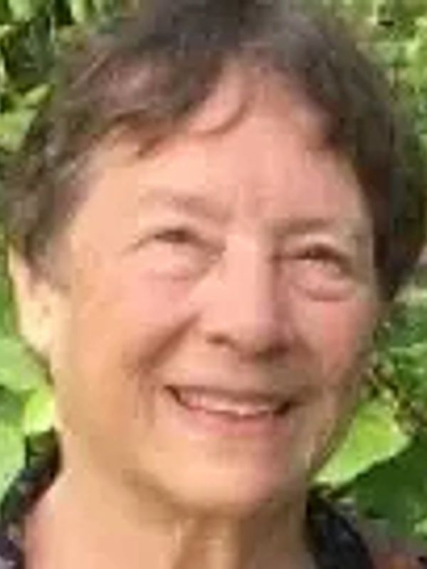 Smiling elderly person outdoors.