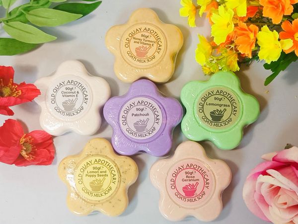Flower-shaped Old Quay Apothecary goats milk soaps with various scents.