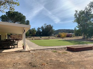 large walking track, outdoor turf and covered patio at Ramona Senior Day Club