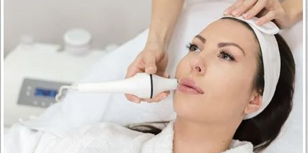 woman receiving cosmetic dermatology treatment
