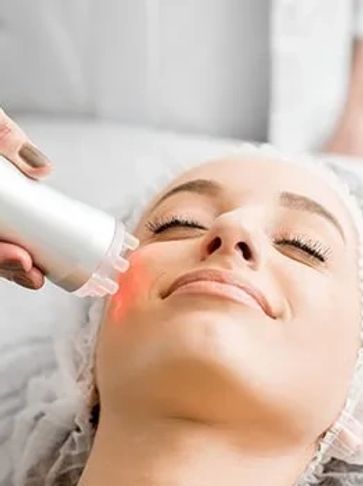 woman receiving dermatolgy cosmetic laser treatment