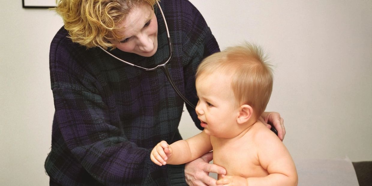 Dermatologist examining baby