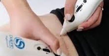 Two handheld ultrasound devices scanning a person's abdomen.