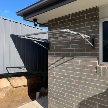 Wall mount clothesline