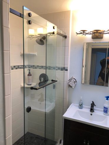 Industrial sliding glass door bathroom install.