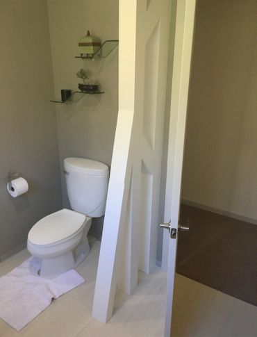 Bathroom partition and design accent semi-wall
