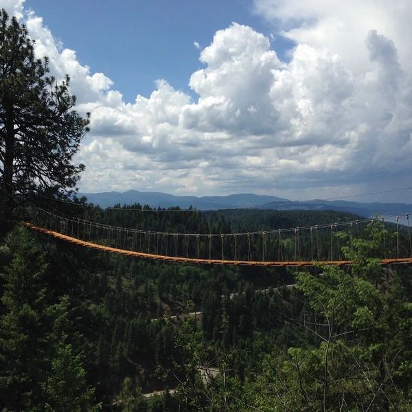 beautiful view of a bridge and clouds