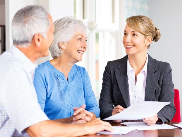Senior couple consulting financial advisor