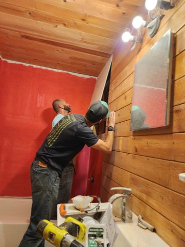 Renovated bathroom with fresh paint, upgraded vanity, shower upgrade & updated lighting fixtures.