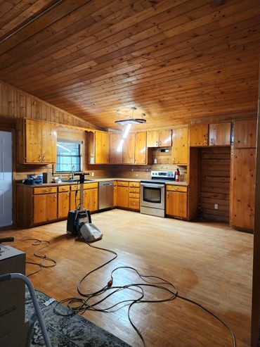 Cost-effective kitchen remodel with fresh cabinet paint and modern hardware upgrades.