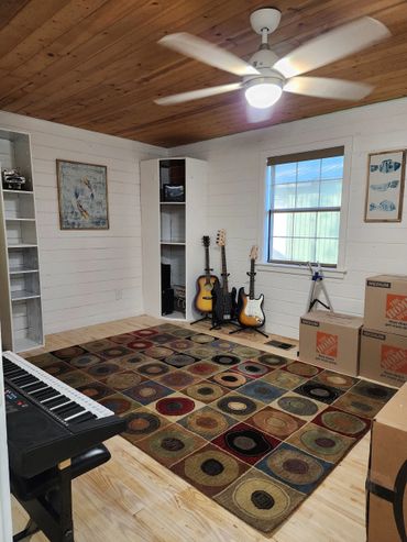 Renovated bedroom with contemporary design, neutral tones, updated lighting and updated furnishings.