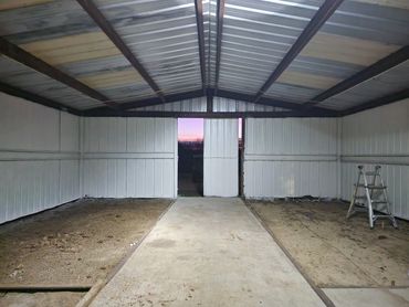 Cleaned and freshly painted barn after extensive haul-off of old materials.