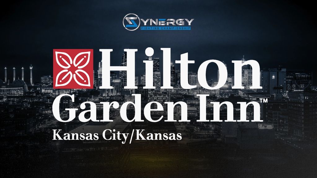 Hilton Garden Inn Kansas City/Kansas logo with city backdrop.