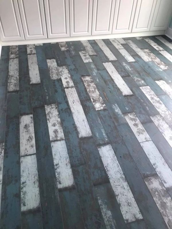 Laminate flooring in rustic blue and white planks (no longer available)