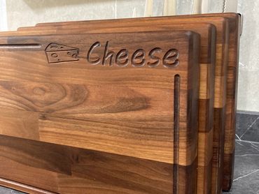Walnut wood bread, cheese, etc serving boards made from pre-used worktops.