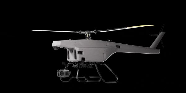 Gray drone helicopter with camera against black background.