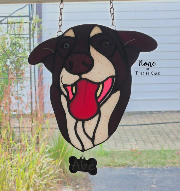 "Abe" 2024, Backlit in a window
Stained + Fused Glass Suncatcher with kiln-fired enamel paint detail