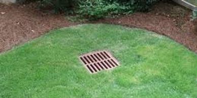 French drains are designed to collect rainwater and channel it downhill.