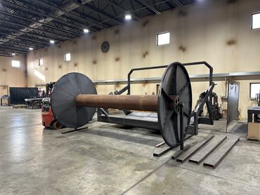 Iron Shield Industries offers liquid fertilizer and water hose reel attachments.