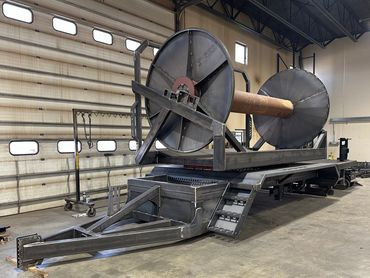 Designing and constructing a hose reel specifically for agricultural applications.