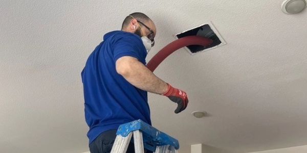 air duct cleaner cleaning air duct with Hepa filtered equipment