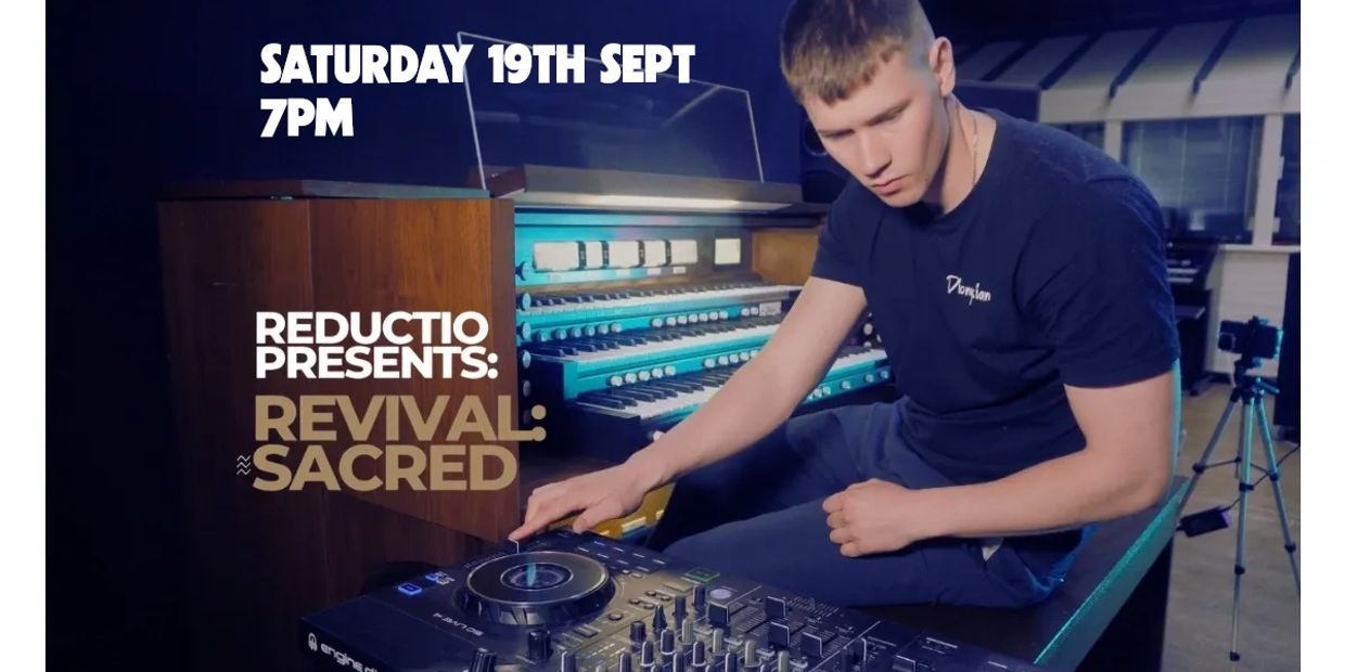 Young man using DJ equipment beside an organ.