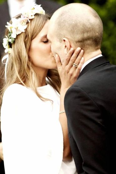 A couple kissing at their wedding handfasting