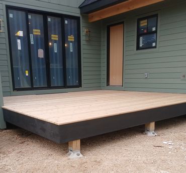 Cedar deck with black fascia trim by Thomm & Murf Remodeling, deck builders in Madison, WI.