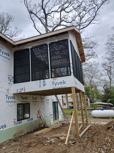 Custom screened-in porch with a vaulted ceiling by Thomm & Murf Remodeling, Madison, Wisconsin.