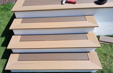 Picture frame stairs composite deck by Thomm & Murf Remodeling, expert deck builders in Madison, WI.